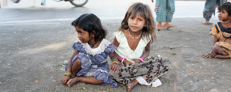 Two Poor Kids on Ground